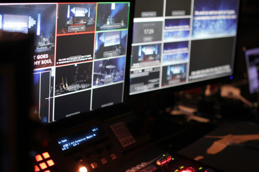 Broadcast control room monitors showing multiple live television feeds